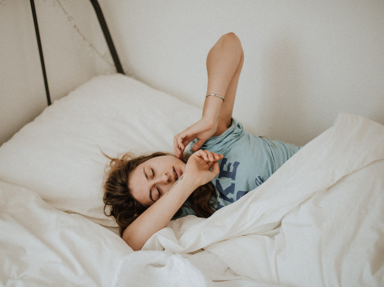 woman in bed waking up