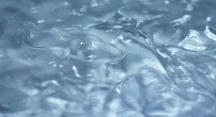 Close-up of clear plastic wrap with wavy texture
